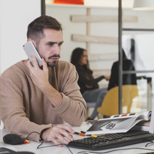 man-talking-phone-office